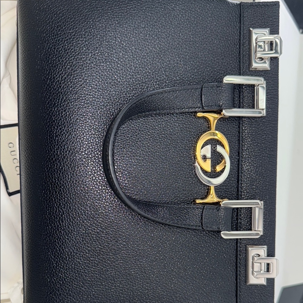Gucci Black and Gold Shoulder Bag with Iconic GG Logo